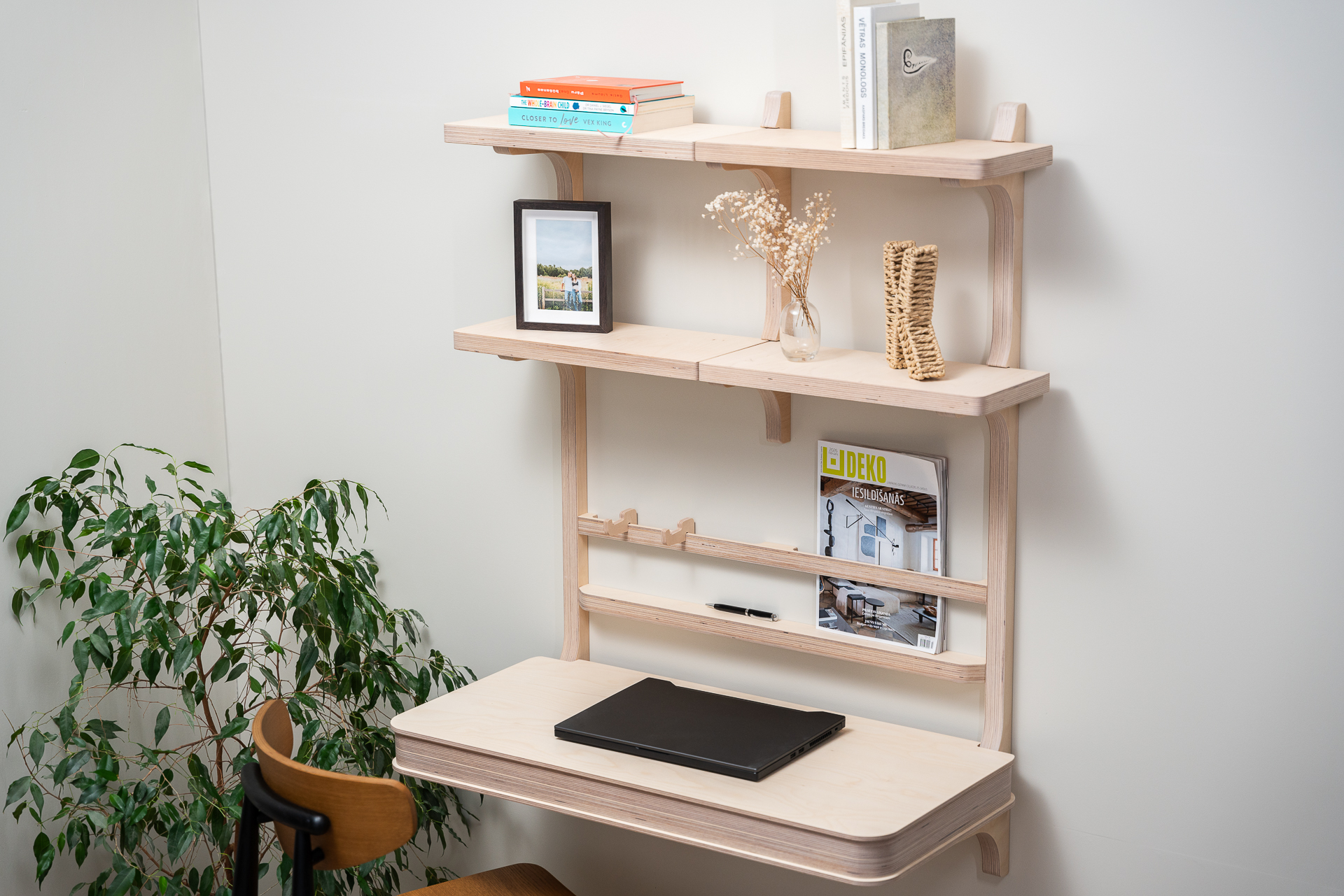 Floating desk with storage and shelves.